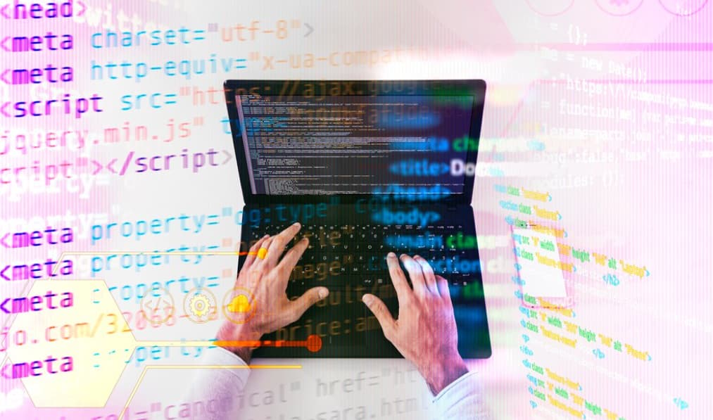 hands typing on the keyboard, colorful coding words on pink background