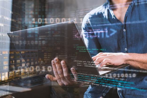 A man holds a laptop in his hands, program code is in the foreground